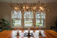 Load image into Gallery viewer, Argent Linear Chandelier in Gold Finish – Dining Table Display